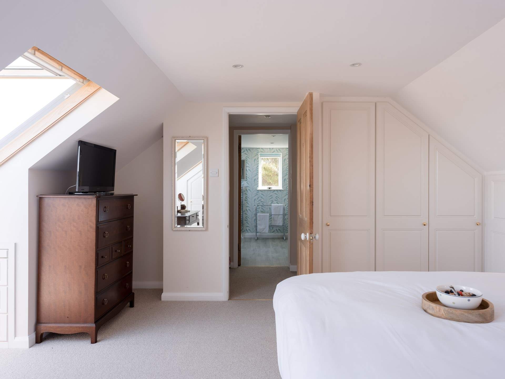 You'll find the bathroom across the landing.