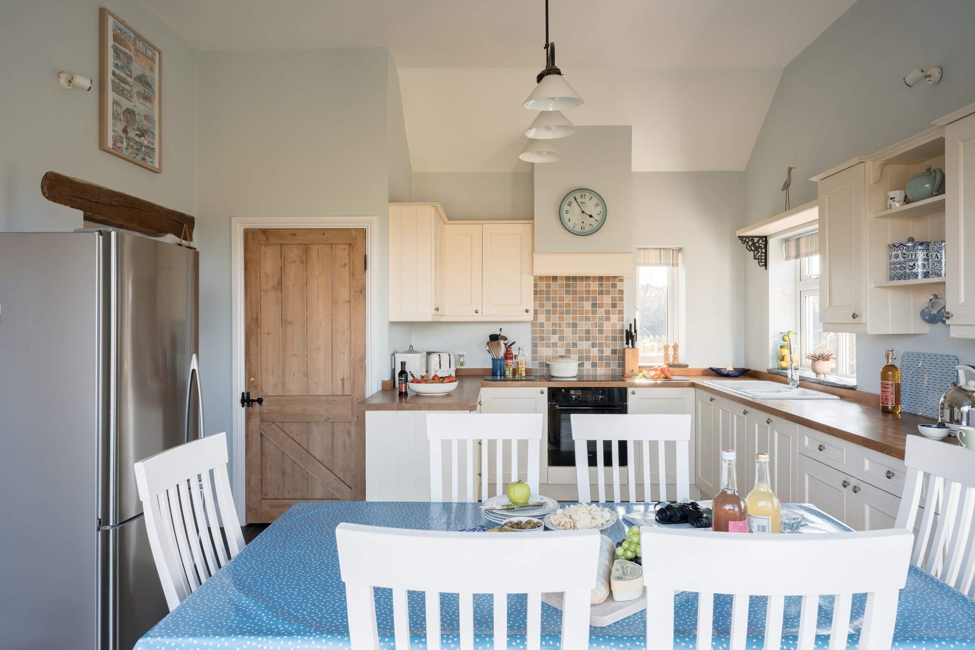 The fully equipped kitchen/diner is both spacious and flooded with light.