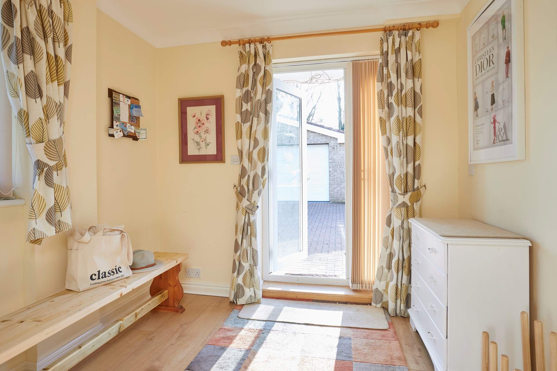 This handy boot-room offers great storage and opens up into the lower ground floor sitting-room.