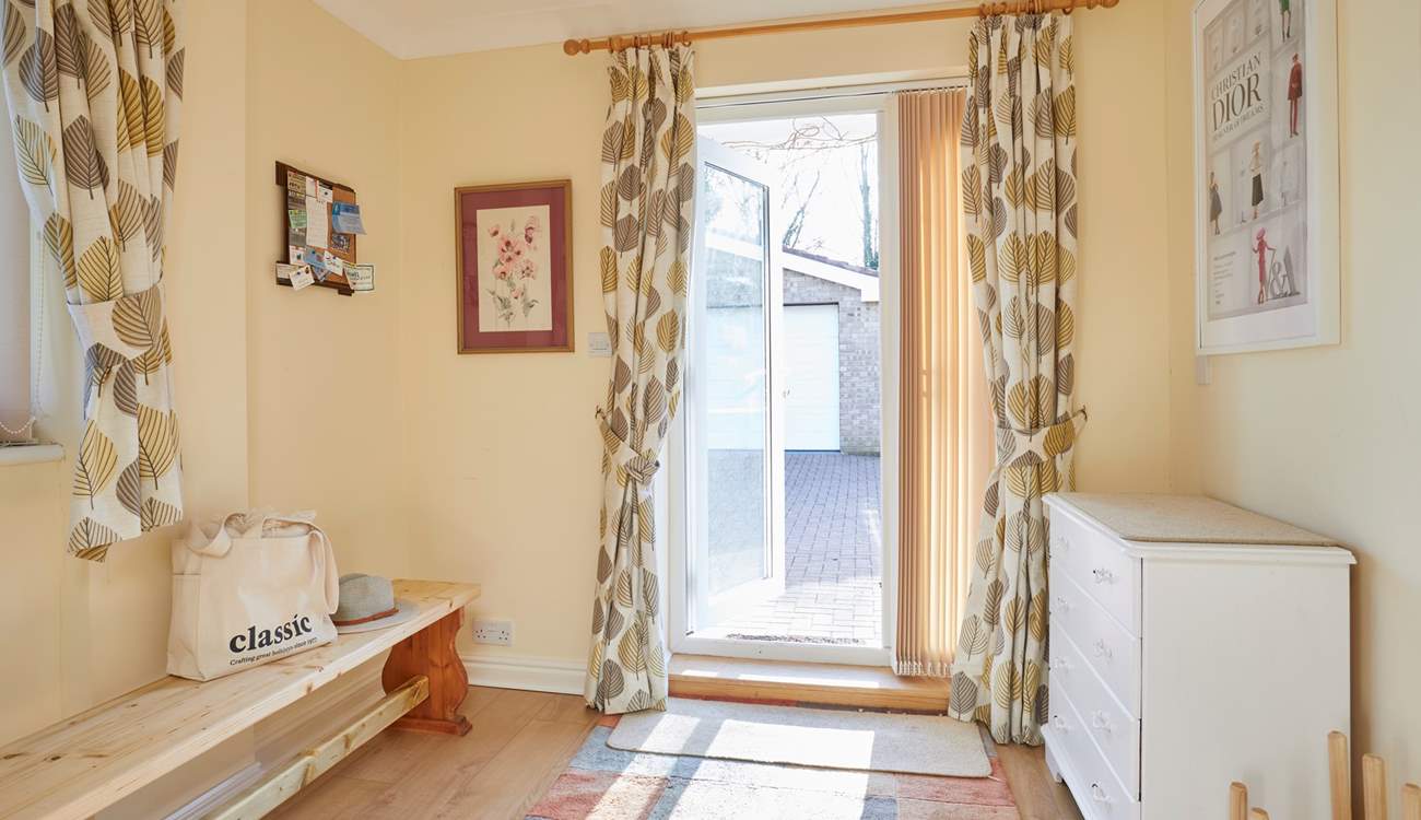 This handy boot-room offers great storage and opens up into the lower ground floor sitting-room.