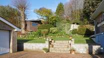 The very well maintained garden offers guests a lovely space to relax in.