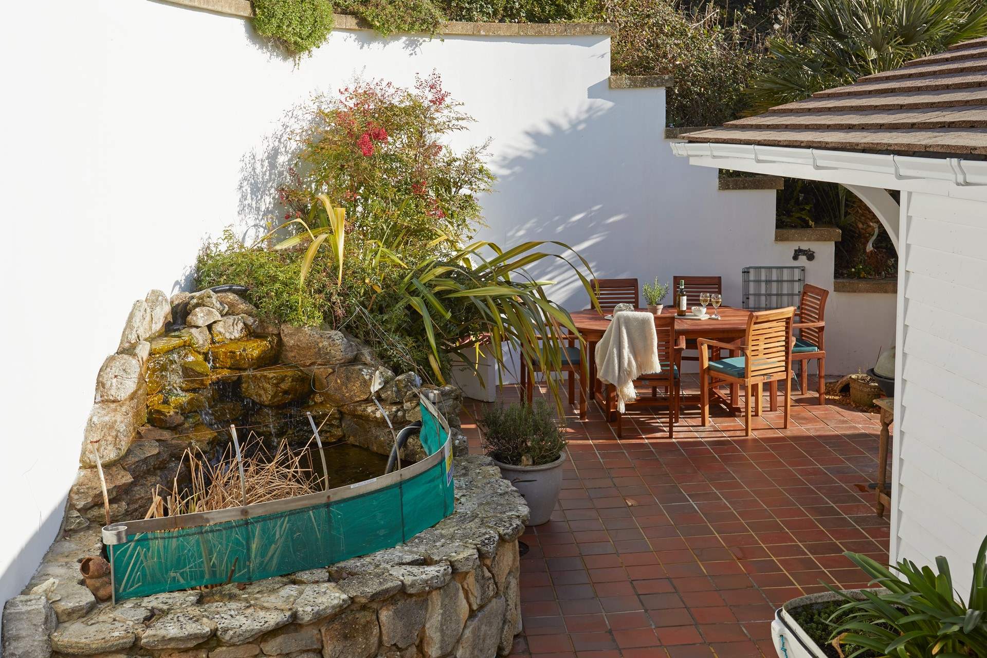 Please supervise children at all times as there is a raised pond on the patio.