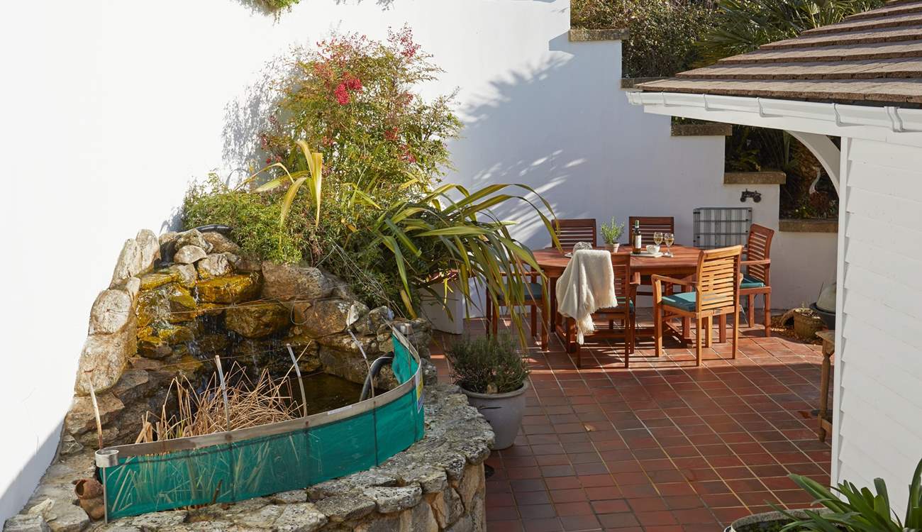 Please supervise children at all times as there is a raised pond on the patio.