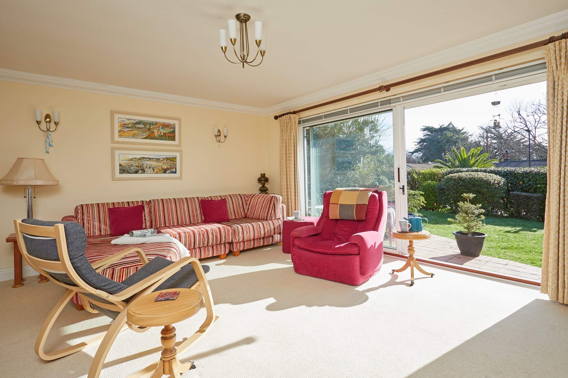 The sitting/dining-room is bright and airy.