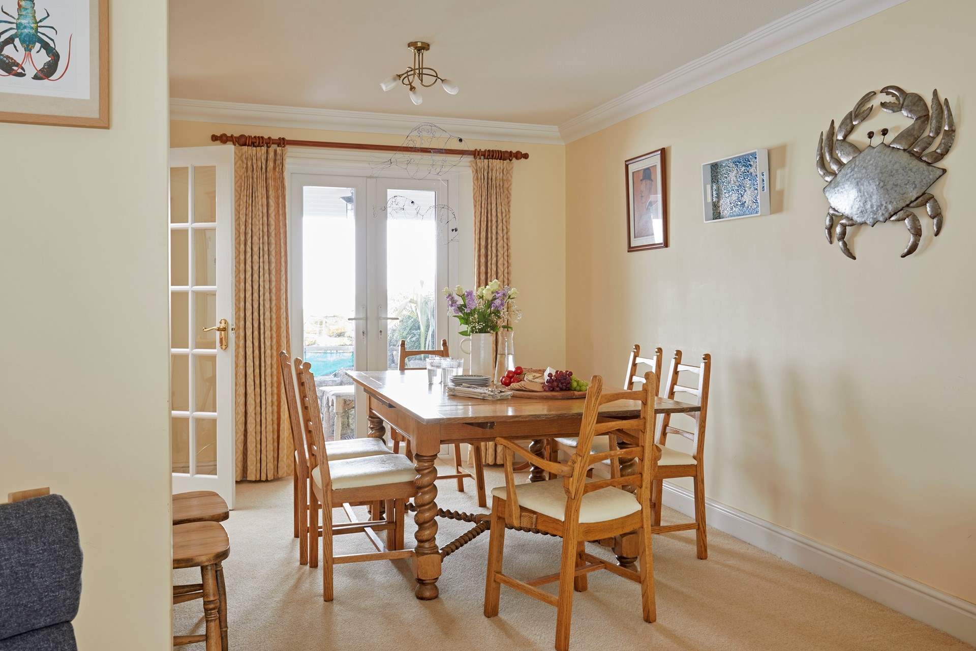 There are patio doors in both the sitting and dining areas, offering easy access to the pretty outside space.