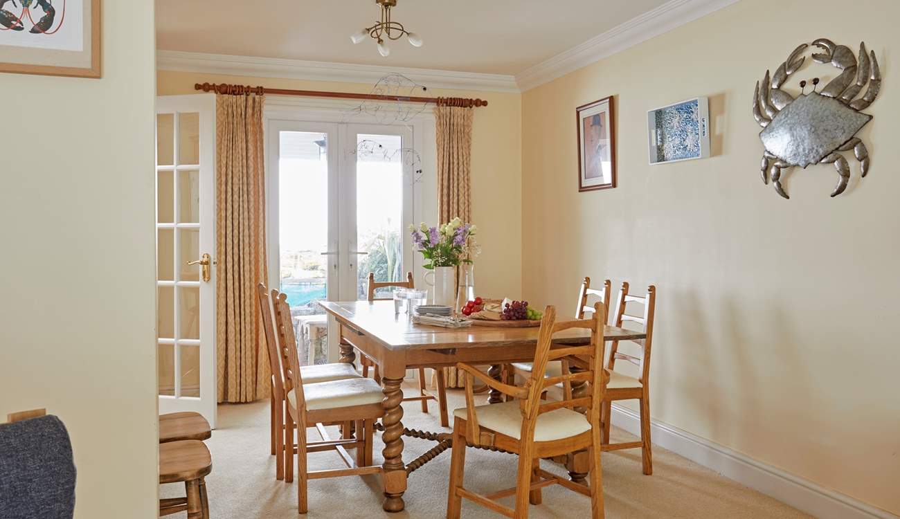 There are patio doors in both the sitting and dining areas, offering easy access to the pretty outside space.