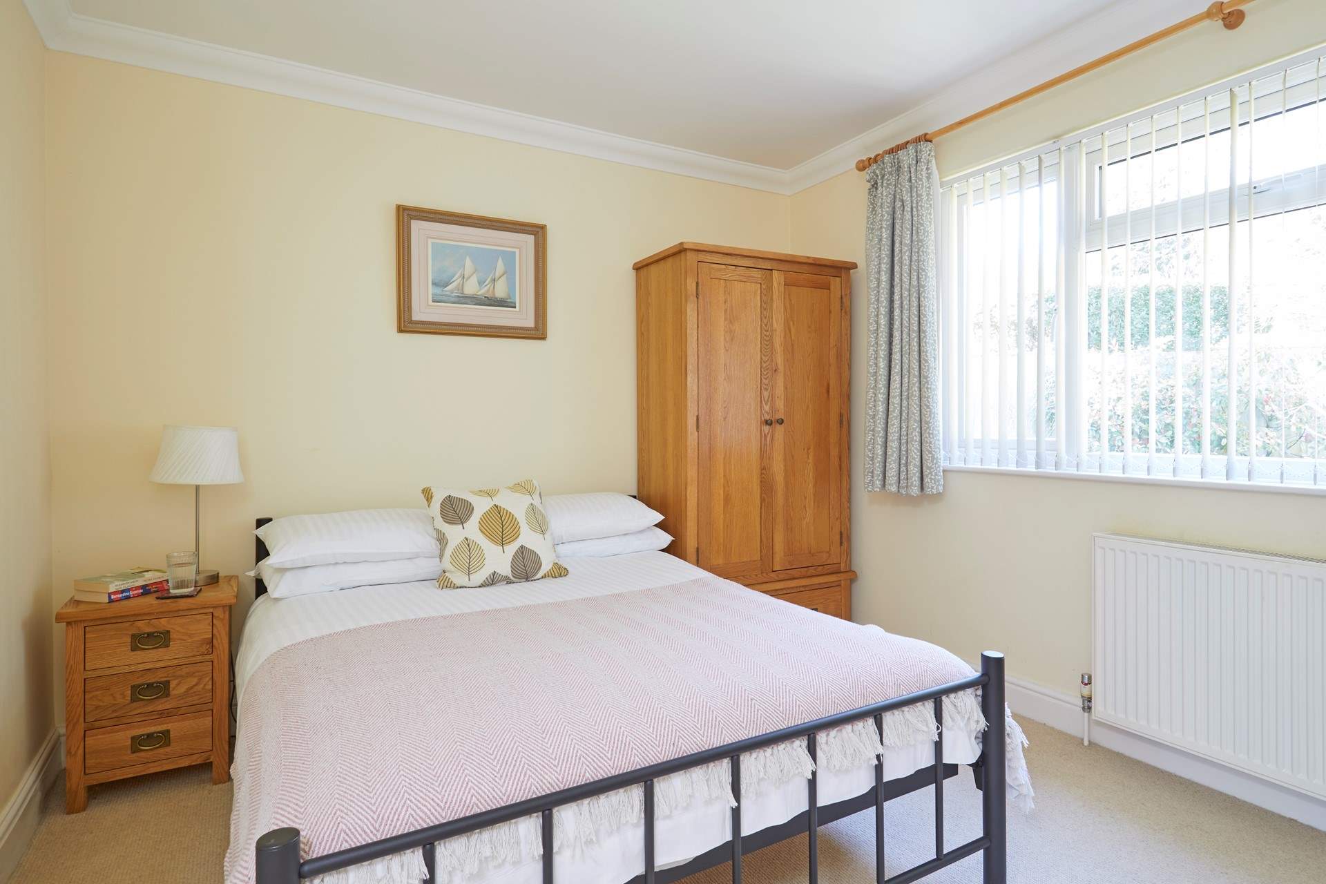 Bedroom 2 with double bed overlooks the pretty garden.