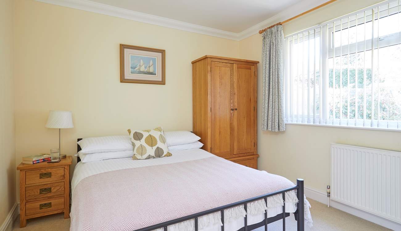 Bedroom 2 with double bed overlooks the pretty garden.