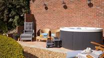 Take an evening dip and relax in the hot tub under a starlit night.