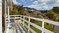 Bedroom 1 has its own balcony, a great spot to relax with your morning coffee.