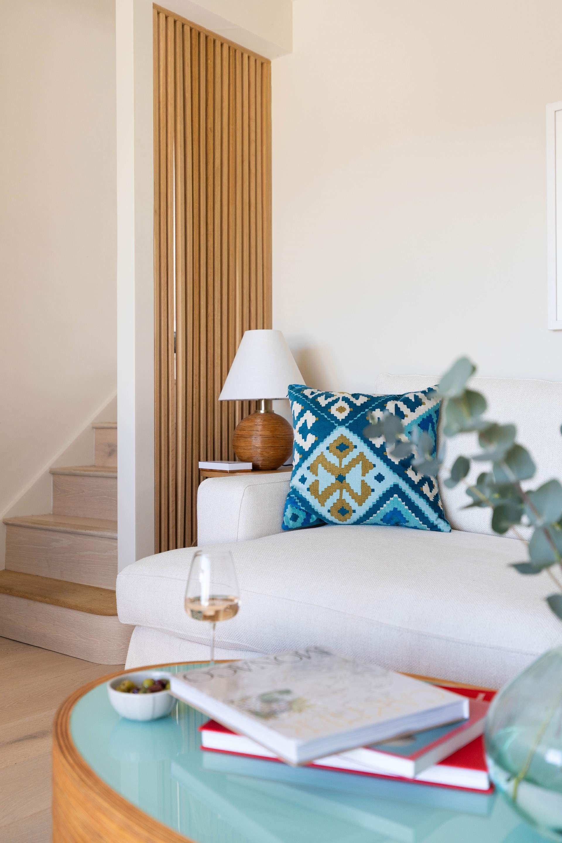 A short flight of stairs lead down to the sitting room.