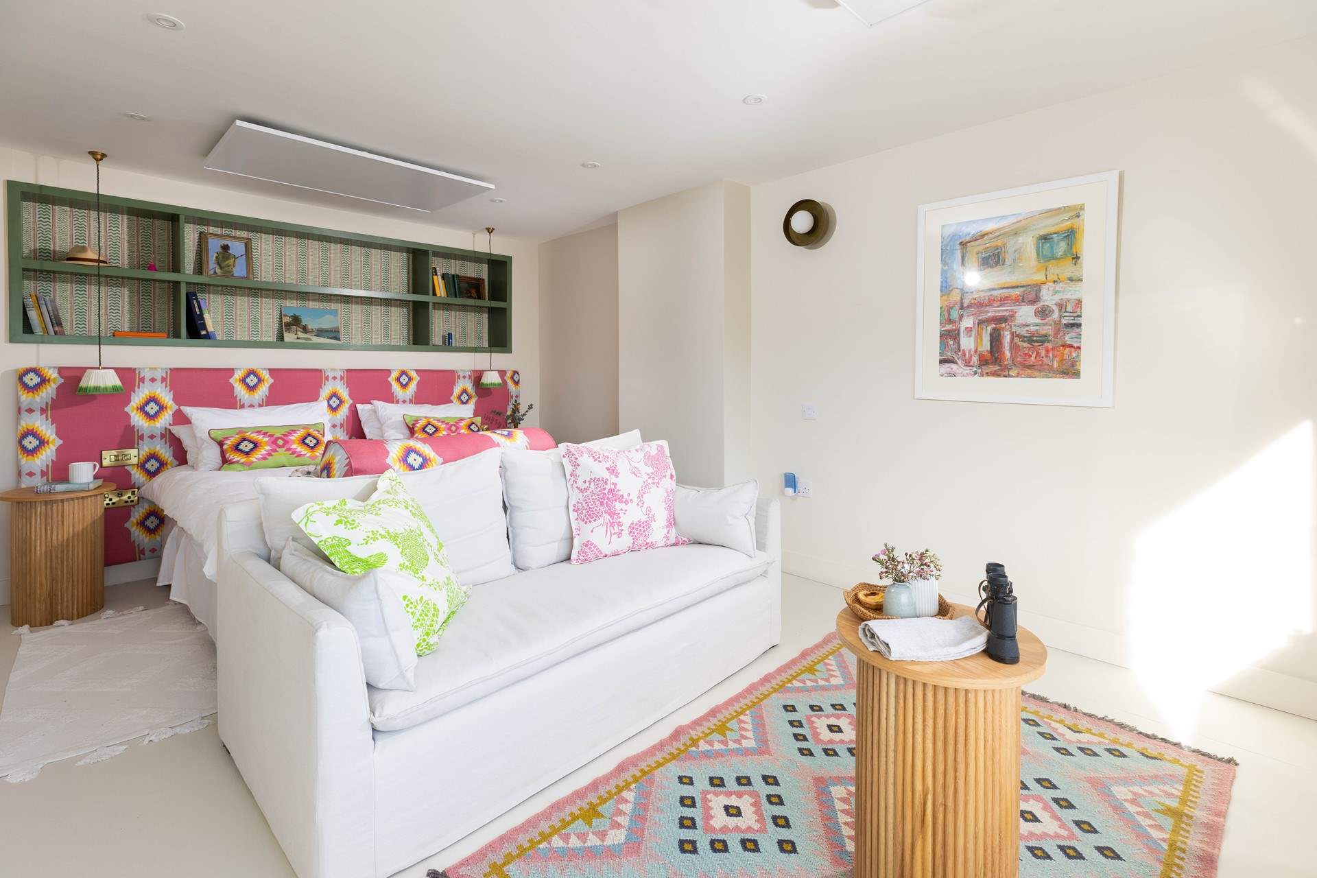 This charming bedroom has a sofa, perfect for a quiet read or taking in the views. 