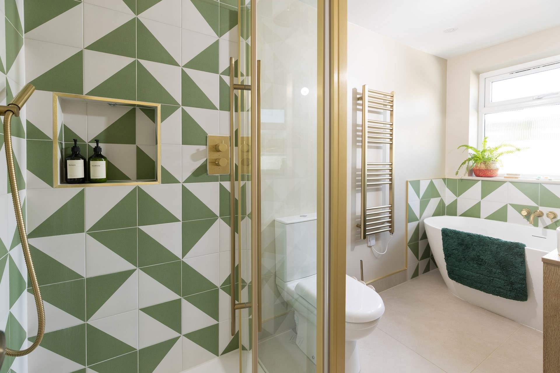 The bathroom on the first floor has a three-quarter sized, free-standing bath and separate shower cubicle. 