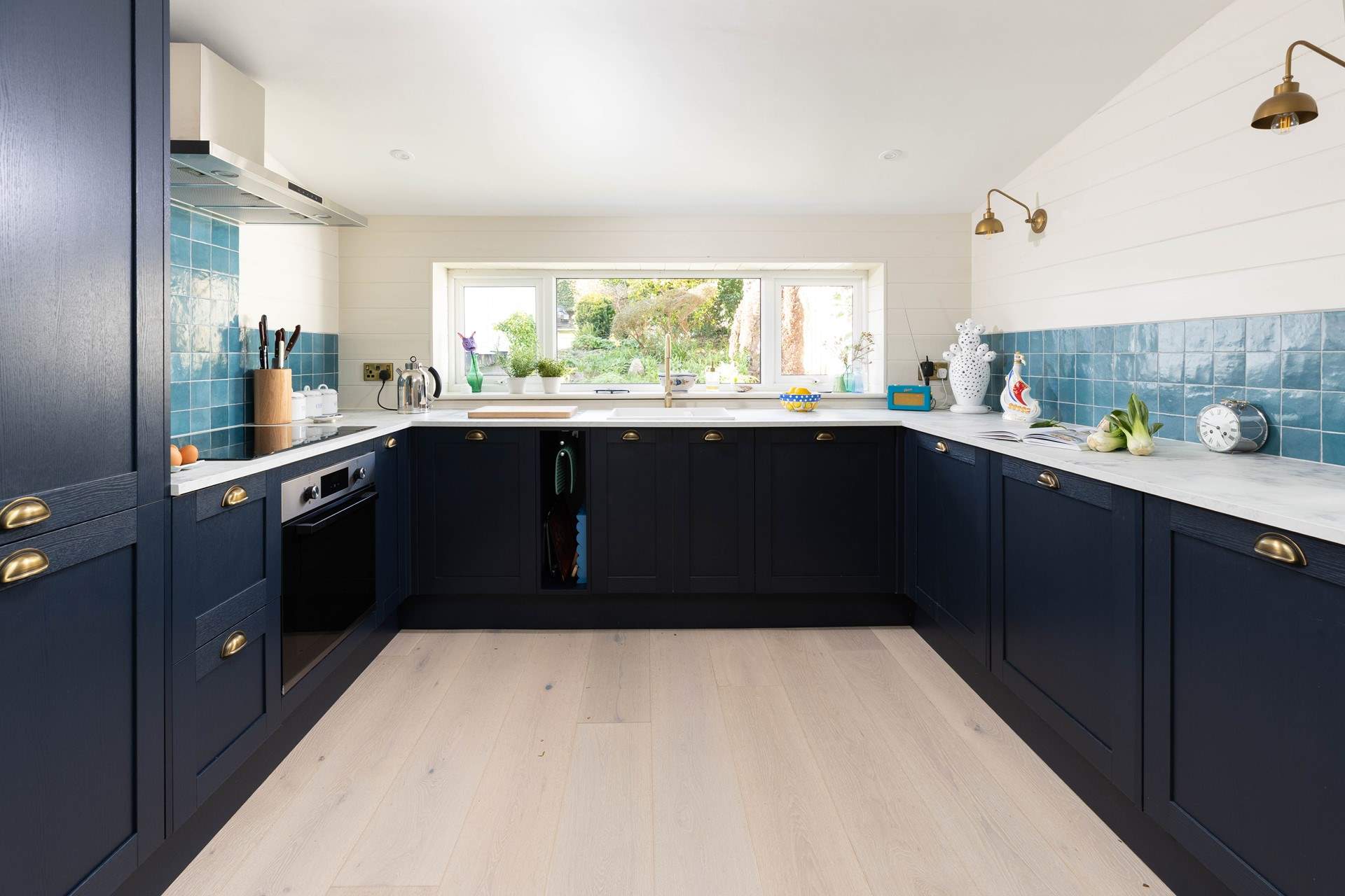 The gorgeous kitchen overlooks the garden to the rear. 