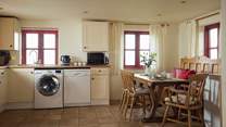 Well-equipped open plan kitchen with endless sea views. 