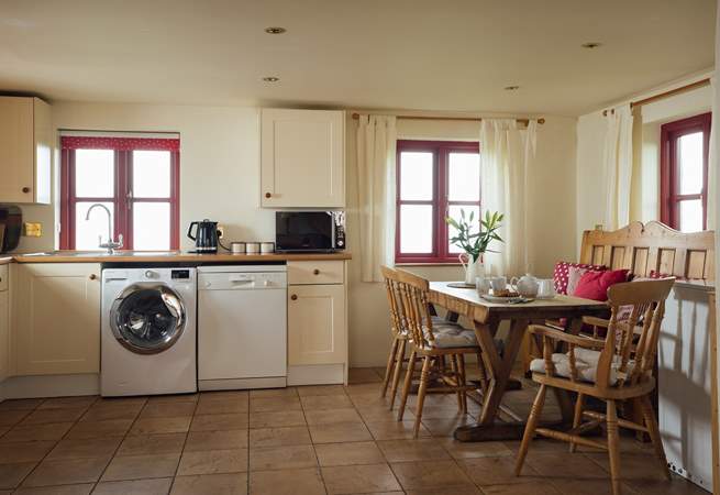 Well-equipped open plan kitchen with endless sea views. 