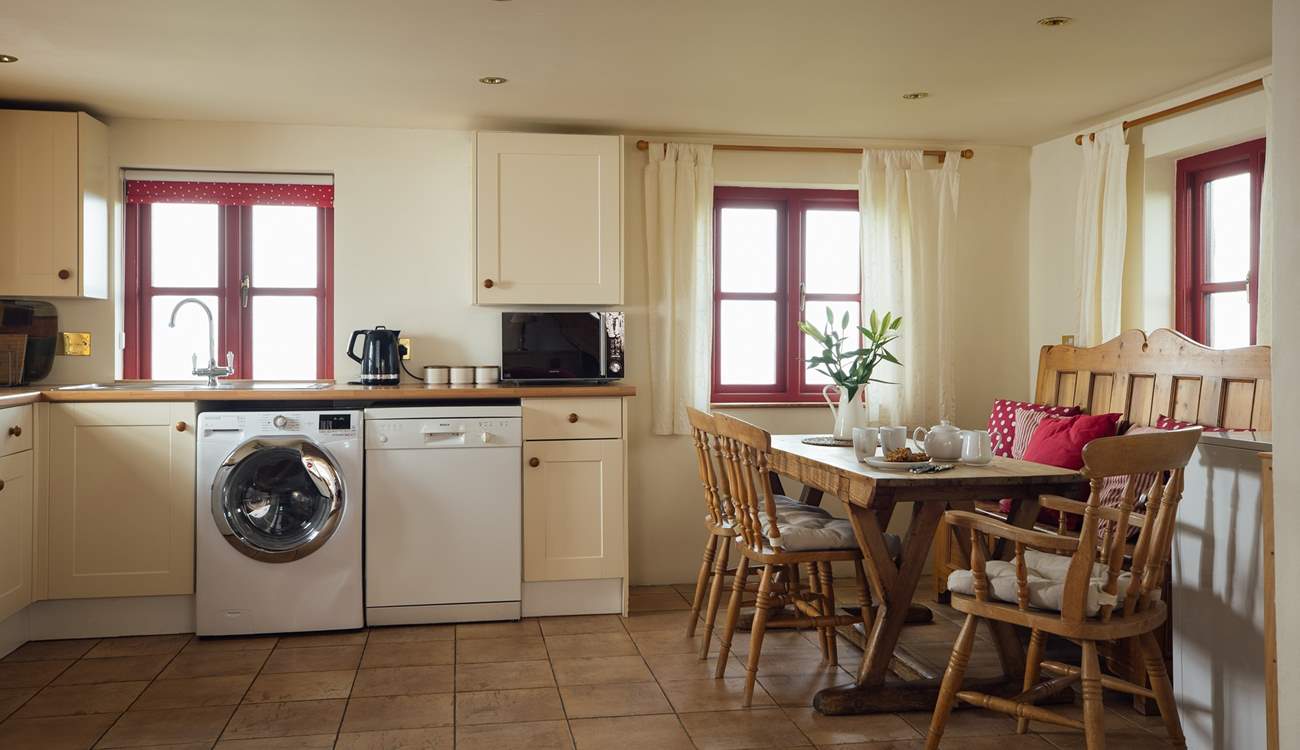 Well-equipped open plan kitchen with endless sea views. 