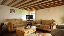 Relax together on the large, comfy sofas after a day on the beach. 