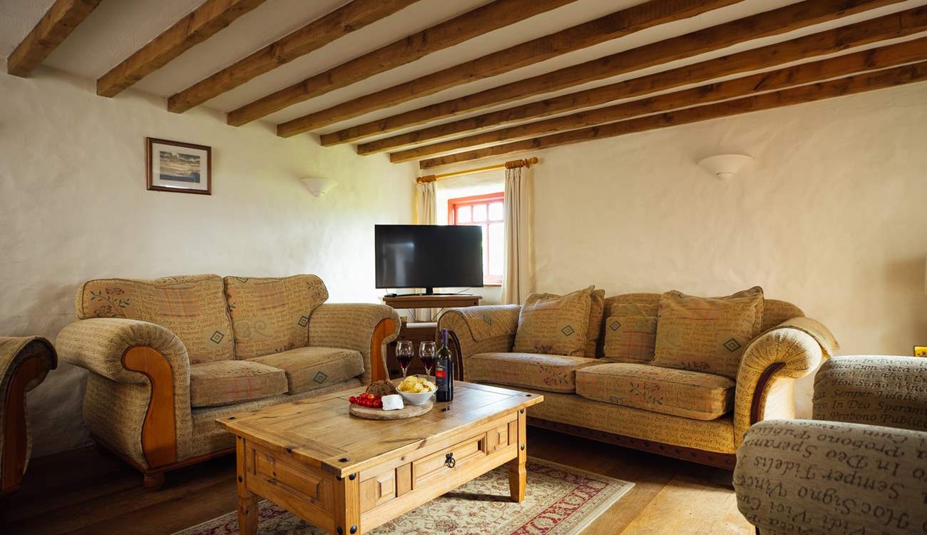 Relax together on the large, comfy sofas after a day on the beach. 