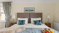 Snuggling up for the night in this super-king size bed is a real treat.