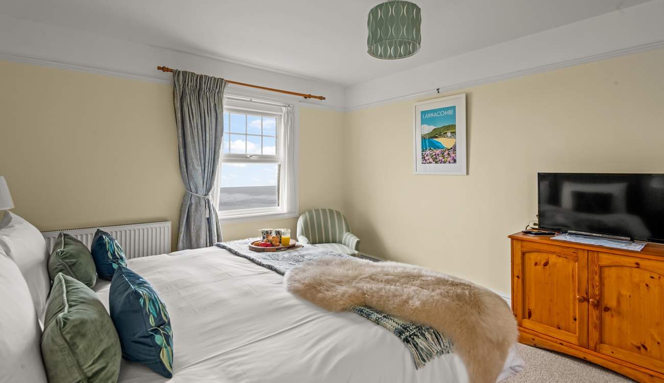 Bedroom 1 enjoys sea views and a TV for those lazy mornings.