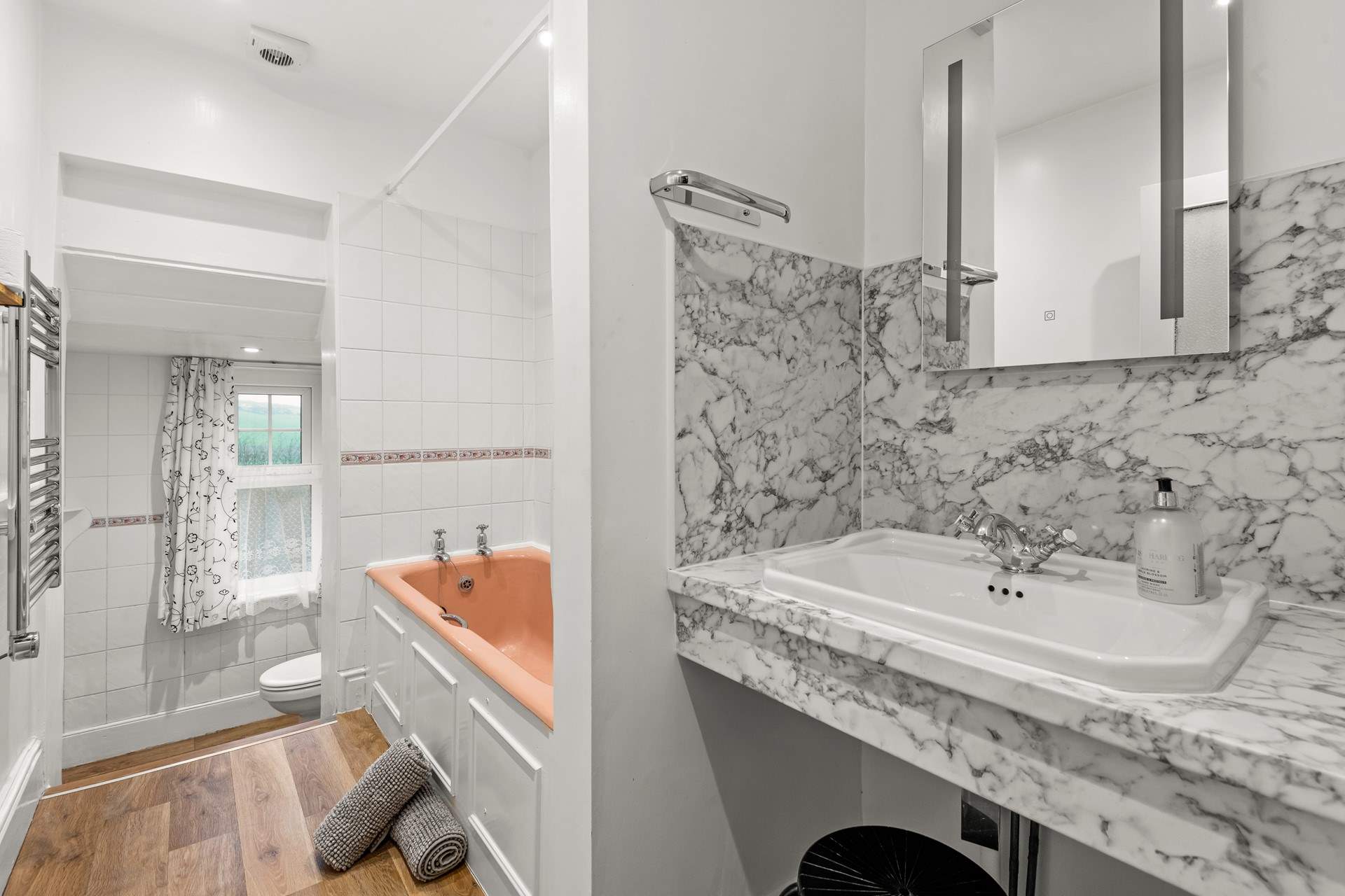 The family bathroom. Please note there are two steps down to the WC area.