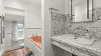 The family bathroom. Please note there are two steps down to the WC area.