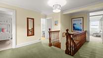 The first floor landing connects all rooms in a rather grand fashion.