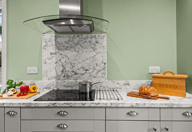 The kitchen is fully equipped and ready for chef to whip up a feast.