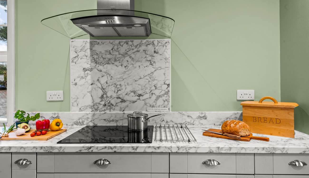 The kitchen is fully equipped and ready for chef to whip up a feast.