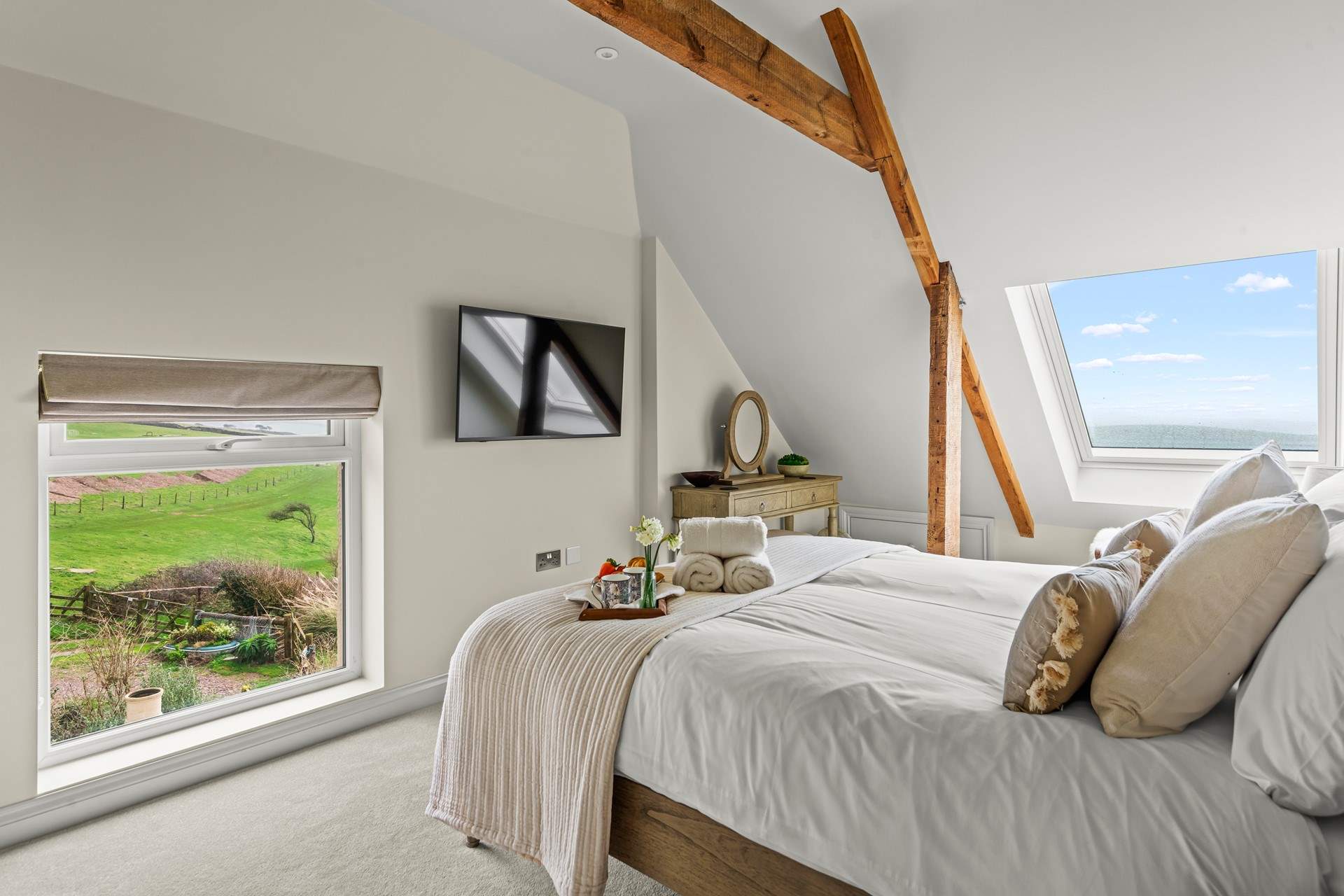 Bedroom 1 boasts both sea and countryside views. Best of both worlds from this beautiful bedroom.