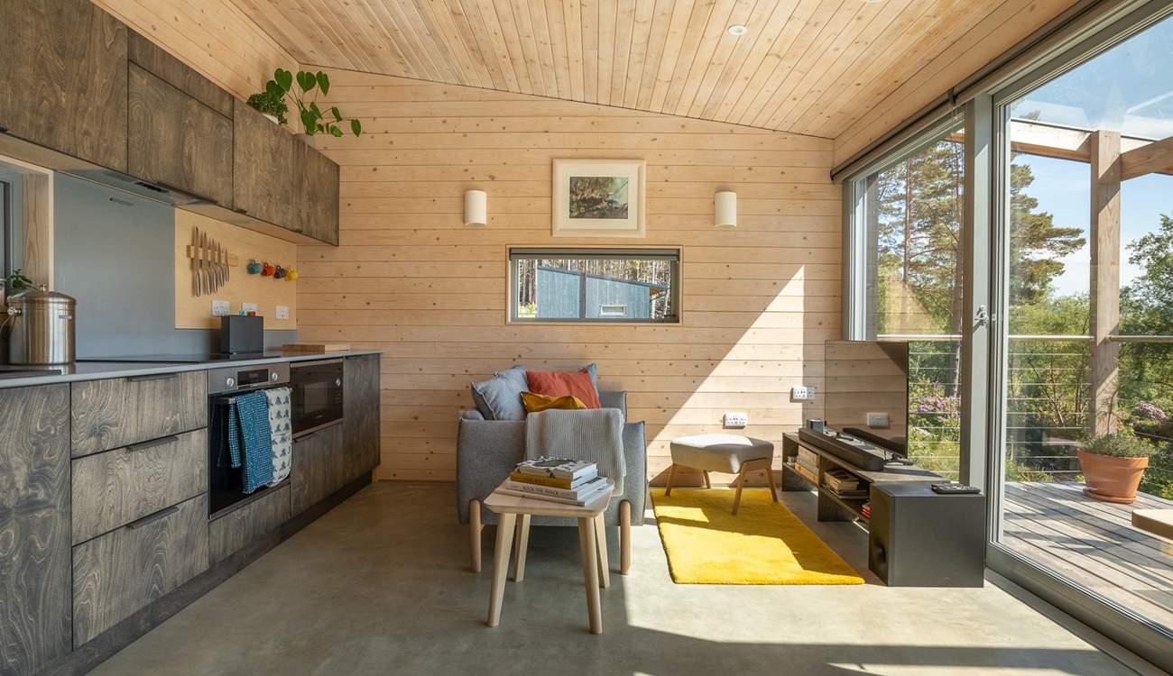 Timber-clad walls, organic textures and gentle pops of colour create a calm yet uplifting atmosphere.
