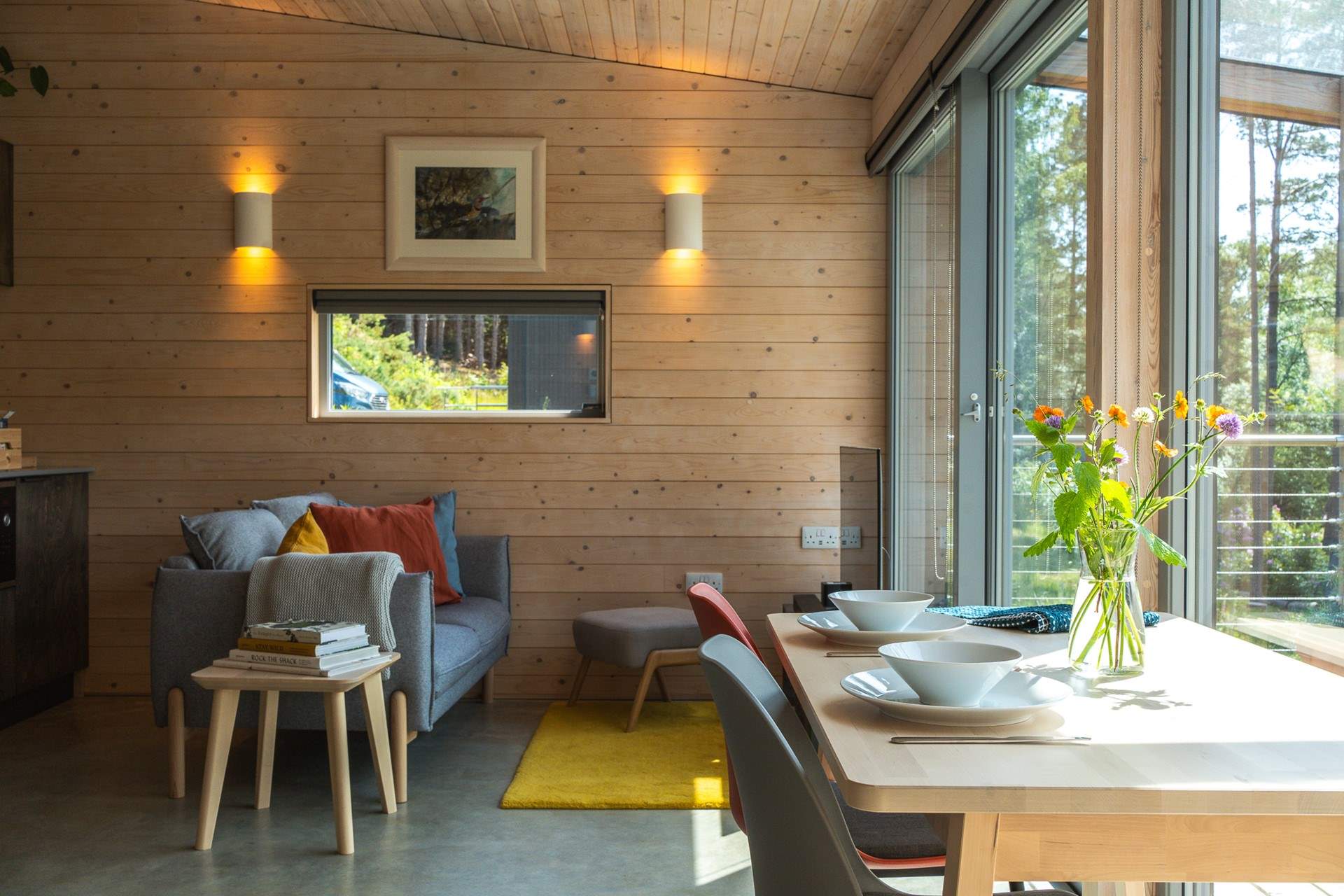 Timber-clad walls, organic textures and gentle pops of colour create a calm yet uplifting atmosphere.