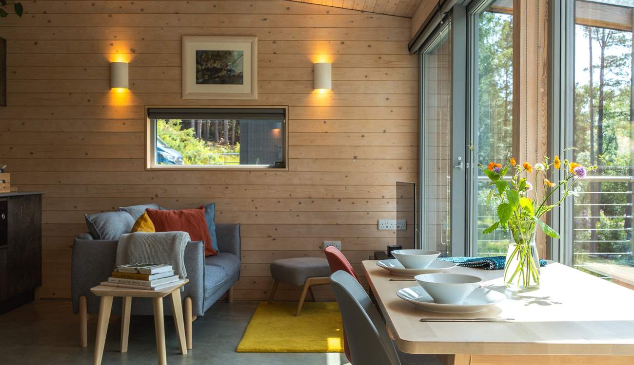 Timber-clad walls, organic textures and gentle pops of colour create a calm yet uplifting atmosphere.