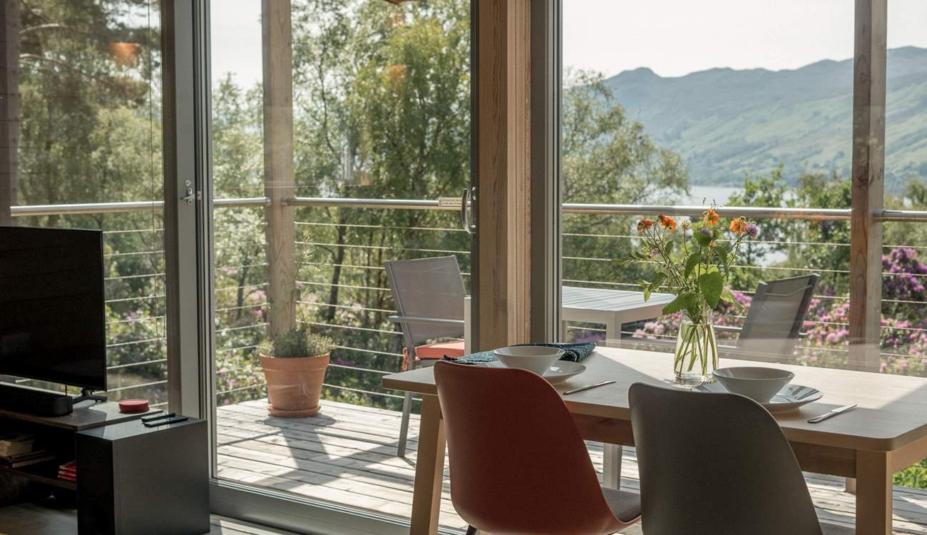 A table and chairs invite alfresco breakfasts in fresh Highland air.