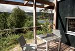A table and chairs invite alfresco breakfasts in fresh Highland air.