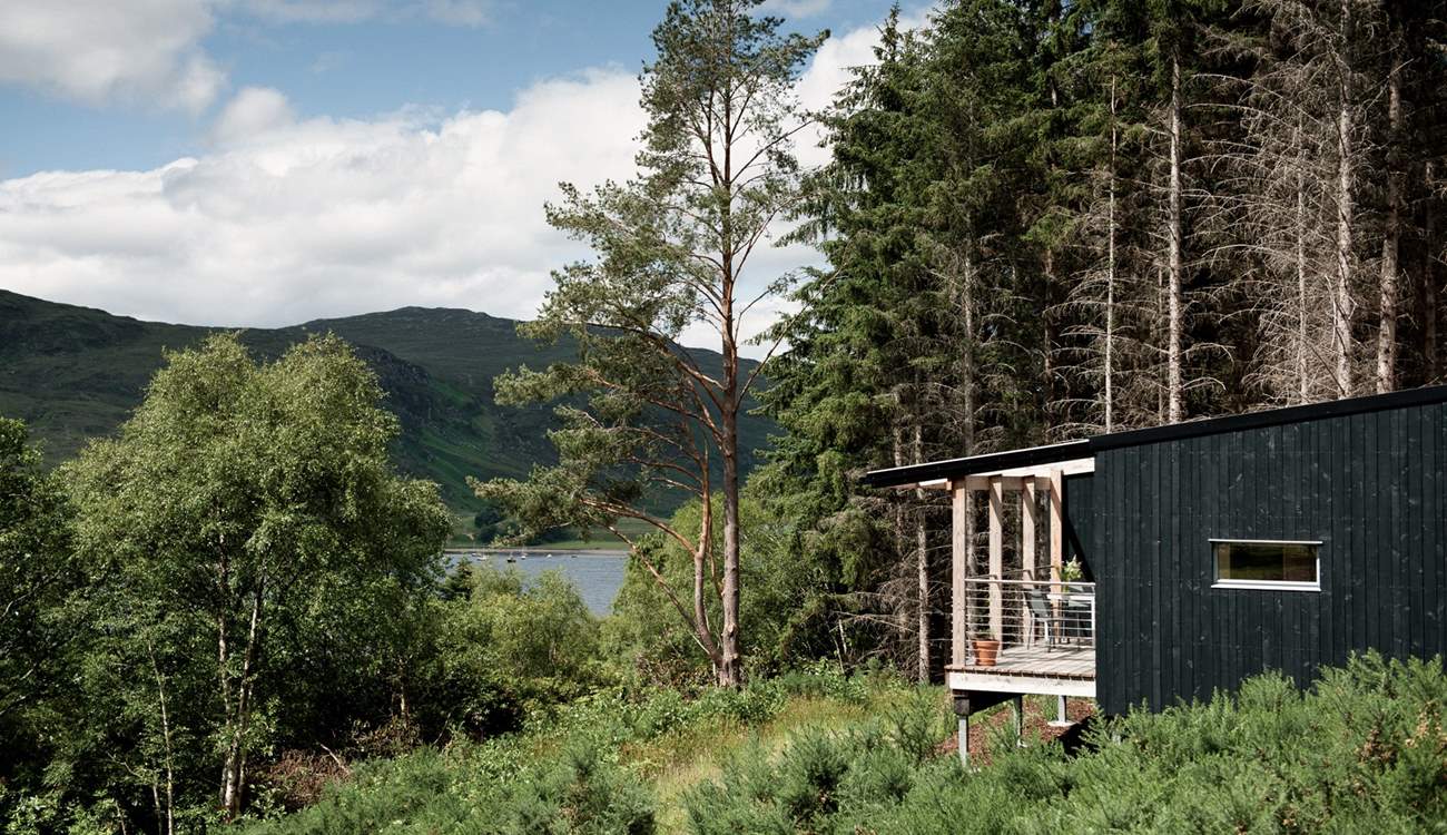 Set within a quiet woodland clearing on the shores of Loch Broom.