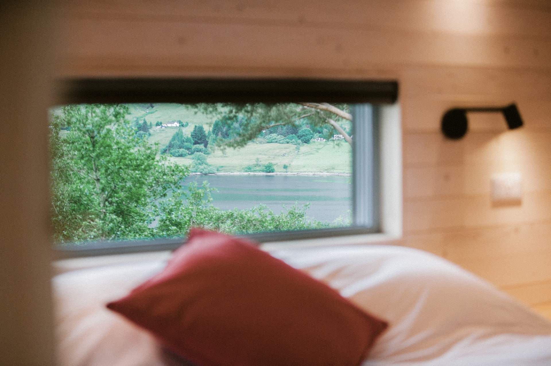 Wake to spellbinding views across the clear waters of Loch Broom.