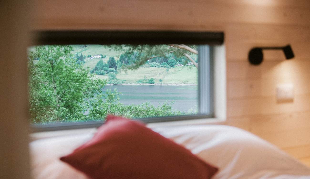 Wake to spellbinding views across the clear waters of Loch Broom.