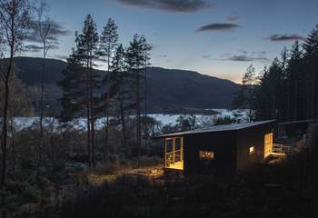 End your evenings wrapped in stillness as light fades over the water.