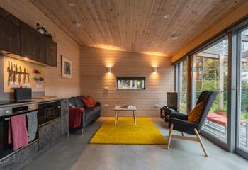 Gorgeous interiors featuring playful pops of colour and warm wood-clad walls.