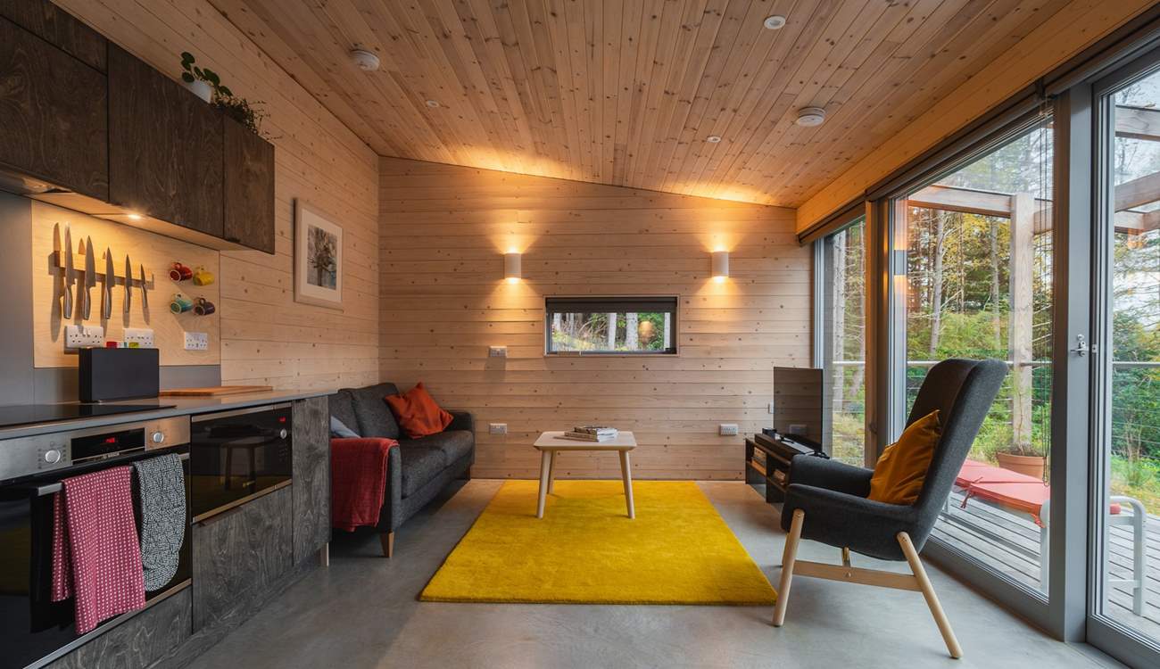 Gorgeous interiors featuring playful pops of colour and warm wood-clad walls.