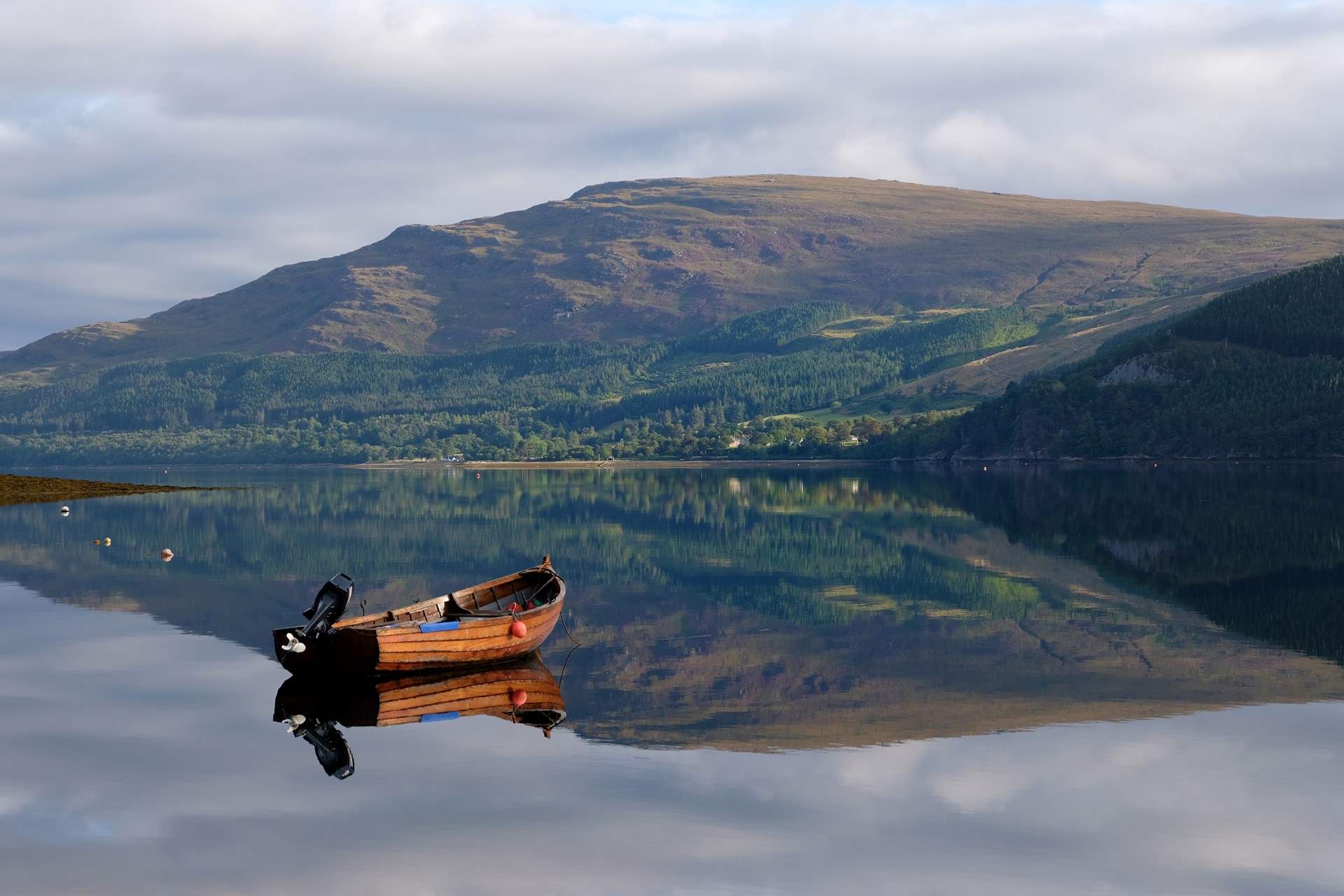 Drift across the glassy waters of Loch Broom. 