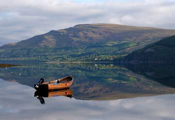 Drift across the glassy waters of Loch Broom. 