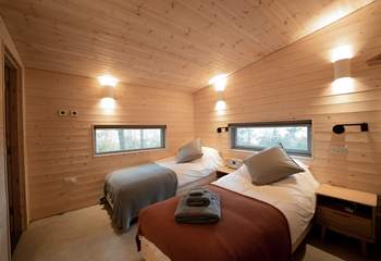 A peaceful haven for restful nights, these twin beds can also be made into a king.