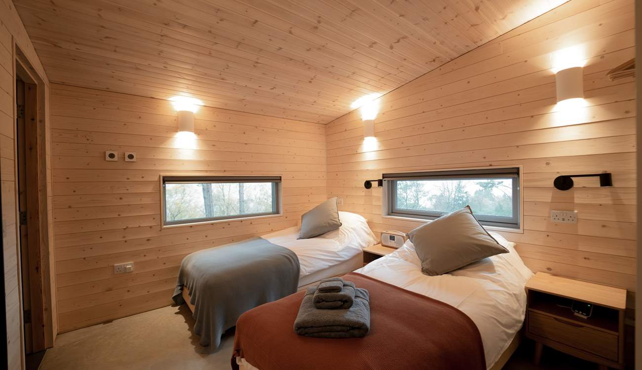 A peaceful haven for restful nights, these twin beds can also be made into a king.