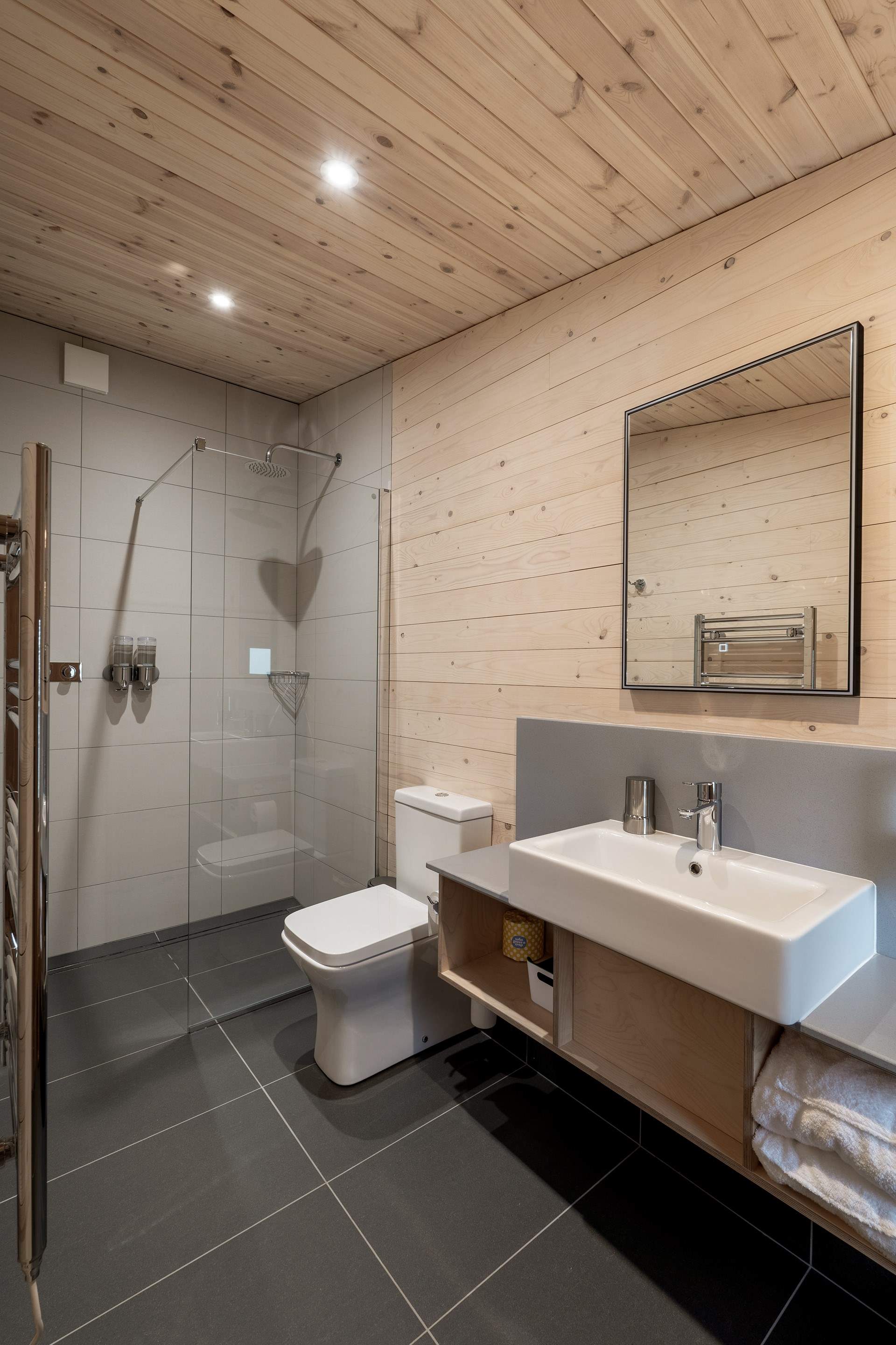 Each bedroom has its own sleek en-suite bathroom. 