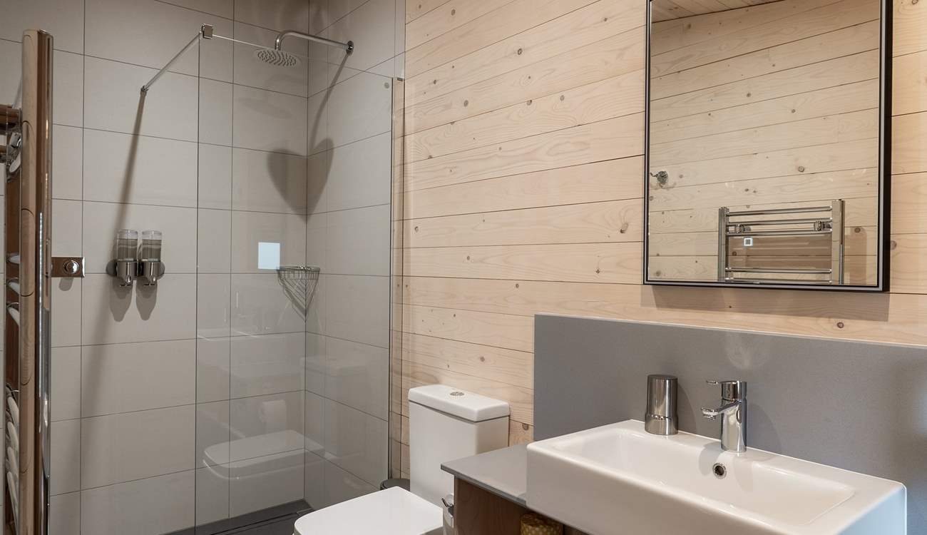 Each bedroom has its own sleek en-suite bathroom. 