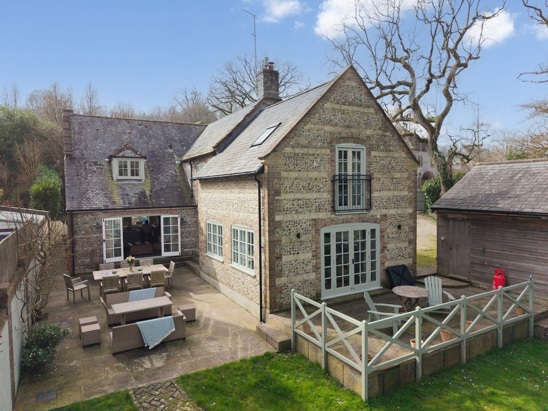 The sense of scale of Oak Tree House continues outside to the double terraces. So much space for everyone to gather, chat, play and dine.