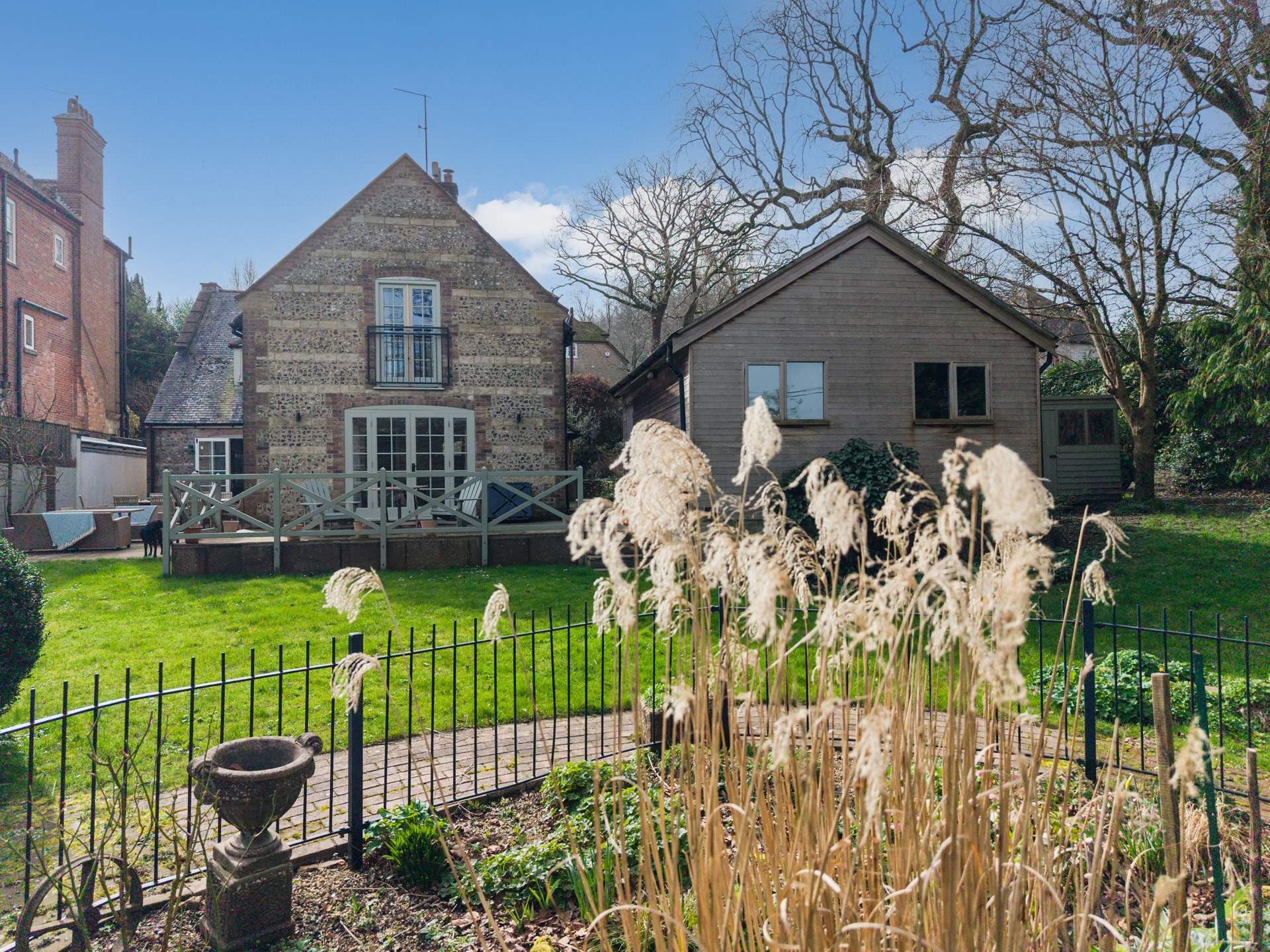 To the right of the house is the games-room and to the left sits the owner's property.